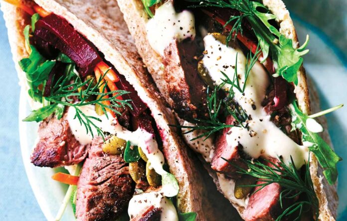 Pita pockets with seared beef and beetroot and pumpkin seed salad